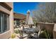 Charming outdoor patio with desert landscaping, view fencing, and shaded seating area at 9154 E Sunflower Ct, Scottsdale, AZ 85266