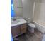 Bathroom featuring vanity with modern faucet and quartz countertop at 11827 W Roanoke Ave, Avondale, AZ 85392