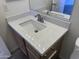 Bathroom featuring vanity with modern faucet and quartz countertop at 11827 W Roanoke Ave, Avondale, AZ 85392