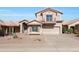 Charming two-story home with a two-car garage, desert landscaping, and welcoming facade at 11832 E Clinton St, Scottsdale, AZ 85259