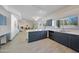 Stylish kitchen featuring gray cabinetry, white countertops, and modern appliances with tiled floor at 11832 E Clinton St, Scottsdale, AZ 85259