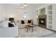 Inviting living room with a cozy fireplace, built-in shelving, and neutral decor at 11832 E Clinton St, Scottsdale, AZ 85259