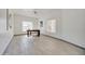 Bright and airy living room with tile floors, lots of natural light, and ceiling fan at 11832 E Clinton St, Scottsdale, AZ 85259