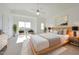 Bright main bedroom with large windows, and modern decor at 11832 E Clinton St, Scottsdale, AZ 85259