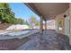 Inviting outdoor pool with covered patio, a perfect spot for relaxation and entertaining at 11832 E Clinton St, Scottsdale, AZ 85259