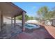 Outdoor patio with a view of the pool, lush landscaping and hardscape, perfect for entertaining at 11832 E Clinton St, Scottsdale, AZ 85259
