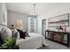 Serene bedroom featuring gray walls, a comfortable bed, and minimalist decor at 1320 W Kennedy Ave, Coolidge, AZ 85128