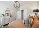 Cozy bedroom with a modern dresser, closet, warm color palette, and stylish lighting at 1320 W Kennedy Ave, Coolidge, AZ 85128