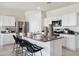 Modern kitchen featuring stainless steel appliances and a large island with seating at 1320 W Kennedy Ave, Coolidge, AZ 85128