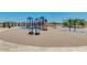 Community playground with slides, swings, and climbing structures in a sand area at 1320 W Kennedy Ave, Coolidge, AZ 85128