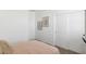 Simple bedroom with a neutral palette, white walls, and closet at 1360 W Hess Ave, Coolidge, AZ 85128