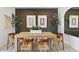 Dining room features a wooden table, modern chairs, stylish decor, and natural light at 1360 W Hess Ave, Coolidge, AZ 85128