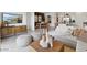 Open-concept living room, showcasing the dining and kitchen areas, with contemporary decor at 1360 W Hess Ave, Coolidge, AZ 85128