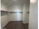 Spacious walk-in closet with carpeted floor and shelving at 1360 W Hess Ave, Coolidge, AZ 85128