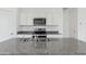 Modern kitchen featuring stainless steel appliances, granite countertops, and white cabinets for a clean aesthetic at 1408 W Hess Ave, Coolidge, AZ 85128