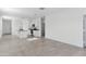 Spacious living area with tile flooring, leading to a kitchen and outdoor access via sliding glass doors at 1408 W Hess Ave, Coolidge, AZ 85128