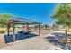 Community playground with a covered picnic area, swings, and play equipment, ideal for Gathering fun at 1408 W Hess Ave, Coolidge, AZ 85128