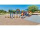 Large community playground with swings, slides, and climbing frames, perfect for active play at 1408 W Hess Ave, Coolidge, AZ 85128