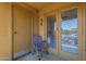 Balcony featuring a chair and sliding glass doors to allow sunlight at 154 W 5Th St # 212, Tempe, AZ 85281