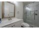 Modern bathroom with white vanity, framed mirror, and a sleek glass-enclosed shower at 154 W 5Th St # 212, Tempe, AZ 85281