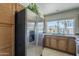 Modern kitchen features stainless steel refrigerator, ample cabinetry, and bright natural light at 154 W 5Th St # 212, Tempe, AZ 85281