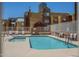 Community pool surrounded by lounge chairs and well-manicured landscaping at 154 W 5Th St # 212, Tempe, AZ 85281