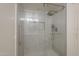 Shower featuring tiled walls, and glass door and shower head at 154 W 5Th St # 212, Tempe, AZ 85281