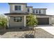 Charming two-story home featuring a low maintenance yard, covered porch, and an attached two-car garage at 15683 W Christy Dr, Surprise, AZ 85379