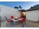 Charming backyard featuring a cozy fire pit area and covered patio for relaxation at 2025 N 87Th Way, Scottsdale, AZ 85257