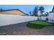 Landscaped backyard features a putting green, charming swing, and relaxing outdoor areas at 2025 N 87Th Way, Scottsdale, AZ 85257
