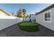 Backyard view of custom artificial grass putting green and landscaped privacy perimeter at 2025 N 87Th Way, Scottsdale, AZ 85257