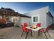 Relaxing backyard with a fire pit, comfortable seating, and a charming pergola at 2025 N 87Th Way, Scottsdale, AZ 85257