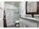 Bathroom featuring a glass enclosed shower with white marble tile surround at 2025 N 87Th Way, Scottsdale, AZ 85257
