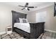 Bedroom featuring a gray wood bed frame and bedside table at 2025 N 87Th Way, Scottsdale, AZ 85257