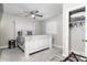 Cozy bedroom with a rustic white wood bed and patterned rug at 2025 N 87Th Way, Scottsdale, AZ 85257