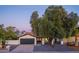 Charming single-Gathering home featuring a well-manicured yard and an attached two-car garage at 2025 N 87Th Way, Scottsdale, AZ 85257
