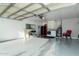 Spacious garage featuring epoxy floors, ample storage, and laundry appliances for convenience at 2025 N 87Th Way, Scottsdale, AZ 85257