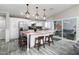 Bright kitchen boasts stainless steel appliances, marble island, and glass doors to the backyard lounge area at 2025 N 87Th Way, Scottsdale, AZ 85257