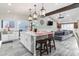 Open floor plan kitchen with stainless steel appliances, island, and seamless connection to the living area at 2025 N 87Th Way, Scottsdale, AZ 85257