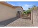 Side yard with rock ground cover and lattice privacy fencing at 21192 E Stirrup St, Queen Creek, AZ 85142