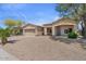 Inviting one-story home featuring desert landscaping, front porch and a convenient two-car garage at 21192 E Stirrup St, Queen Creek, AZ 85142