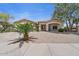 Well-kept single Gathering home with desert landscaping, covered front porch and two car garage at 21192 E Stirrup St, Queen Creek, AZ 85142