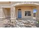 Up close view of the front door under a covered porch at 21192 E Stirrup St, Queen Creek, AZ 85142