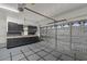 Spacious two car garage with built-in cabinets and insulated door at 21192 E Stirrup St, Queen Creek, AZ 85142