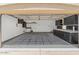 View of spacious garage featuring ample storage and cabinets at 21192 E Stirrup St, Queen Creek, AZ 85142