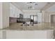 Bright kitchen features white cabinets, granite countertops, stainless steel appliances and stylish backsplash at 21192 E Stirrup St, Queen Creek, AZ 85142