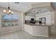Sunlit kitchen with white cabinets, granite countertops, stainless steel appliances and breakfast nook at 21192 E Stirrup St, Queen Creek, AZ 85142