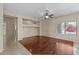 Spacious living room with hardwood floors, neutral paint and ample natural light at 21192 E Stirrup St, Queen Creek, AZ 85142