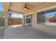 Spacious covered patio has dual sliding glass doors, and custom lattice privacy screen at 21192 E Stirrup St, Queen Creek, AZ 85142