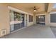 Covered patio features dual sliding glass doors and a ceiling fan for outdoor living at 21192 E Stirrup St, Queen Creek, AZ 85142